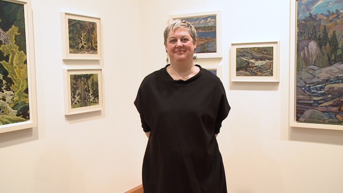 image of woman standing in a gallery