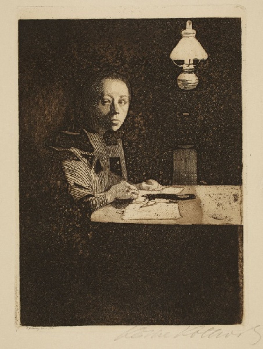 Image of lady writing at a table