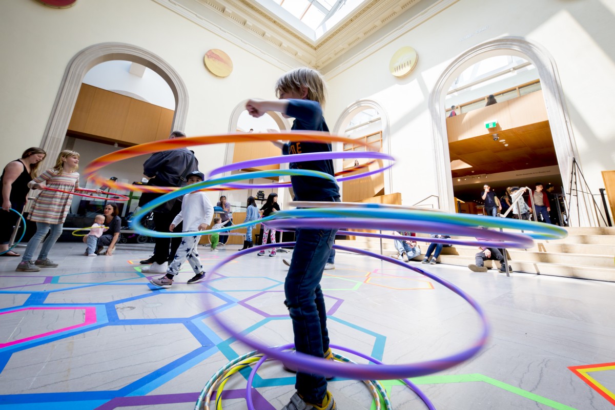 Image of child playing with hula hoops