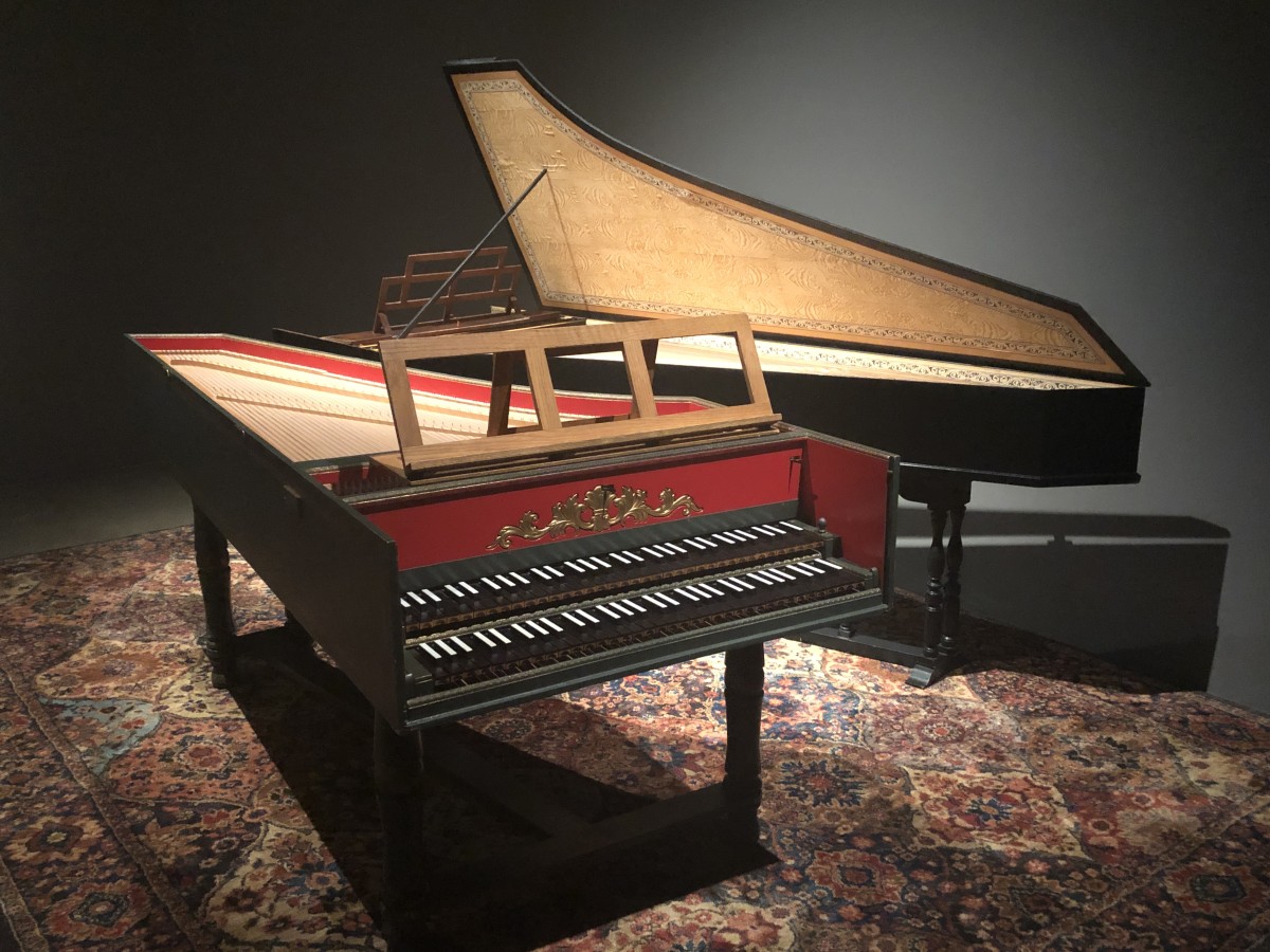 image of two harpsichord instruments on a persian carpet
