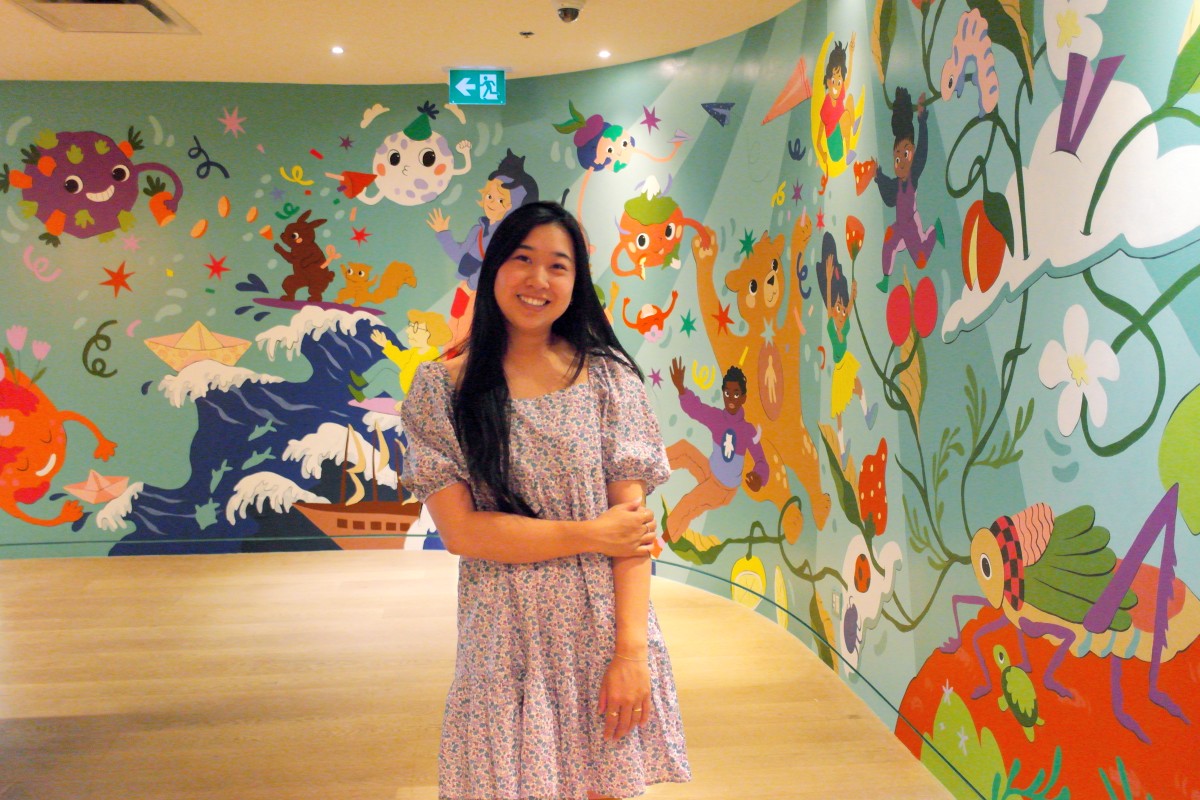 Artist Yen Linh Thai with her mural