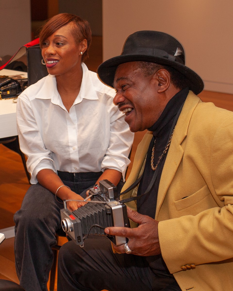 Prince Robinson seated with his daughter Jeanette Robinson-Daley