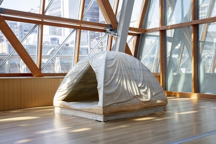 A sculpture of a marble tent