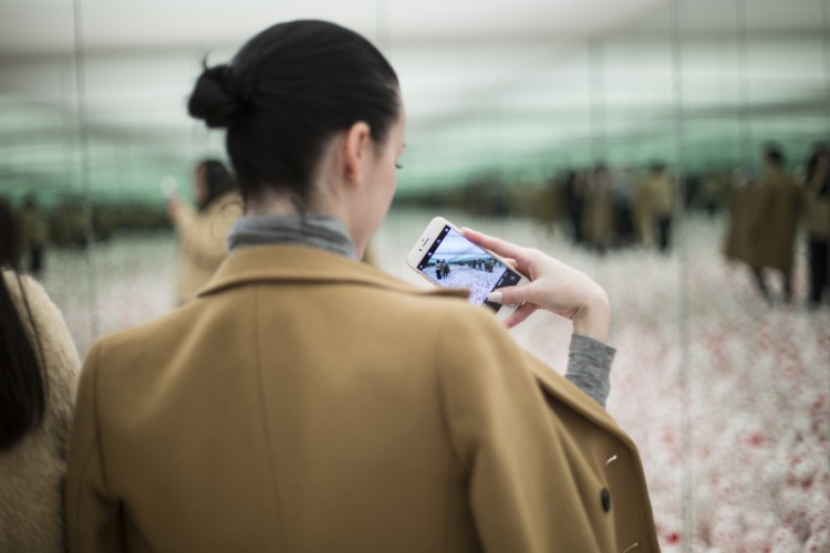 Visitors in Kusama Infinity Mirror Room