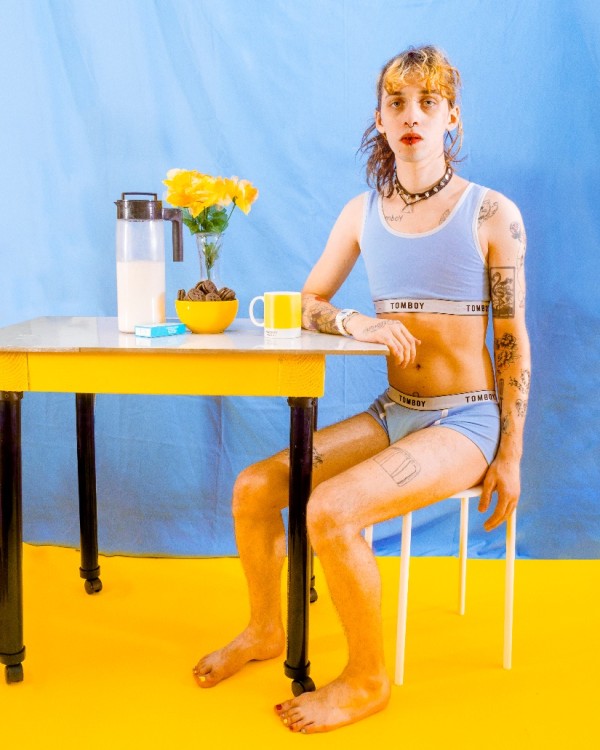 Self Portrait with Table and Flowers
