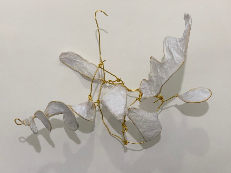hanging bird sculpture made of wire and paper