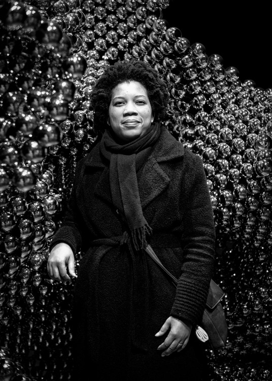 Sharl G. Smith in front of artwork entitled Value Shift, Stainless steel spheres