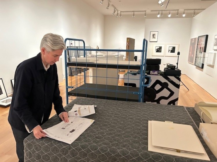 Sophie Hackett, Curator, Photography, installing artworks for the Collective Visions: Celebrating 25 Years of Photography exhibition