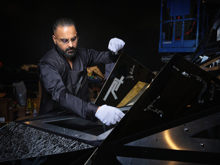 Artist portrait, Ranbir Sidhu. Work shown: Asteroid 3033 X1, 2025. Stainless steel, aluminum, gold foil, fibre optics, LED, crystal.