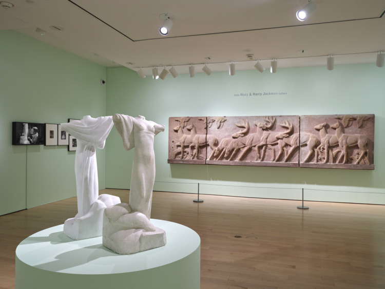 Object in front: Florence Wyle, Sea and Shore, c. 1950. Marble, 93.5 × 33 × 41 cm. Object on the wall in the background: Frances Norma Loring, Deer Panel, c.1941. Tripartite painted plaster, 99.1 x 117 x 480 cm.
