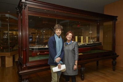 Mick Jagger and Maxine Granovsky Gluskin in front of model ship display