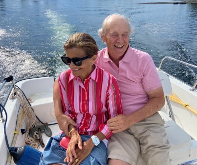 David and Robin Young sitting in motor boat on lake