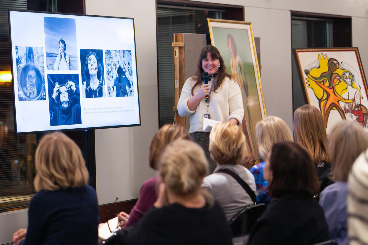 Curator speaking at Womens Art Initiative event
