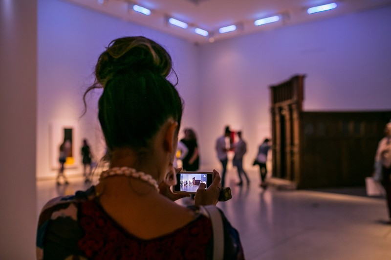 Woman shooting footage in the gallery