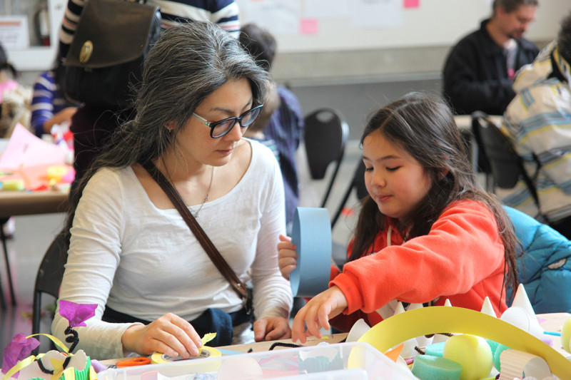 Girl and her mom making art