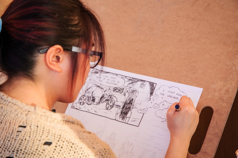 Student drawing a comic