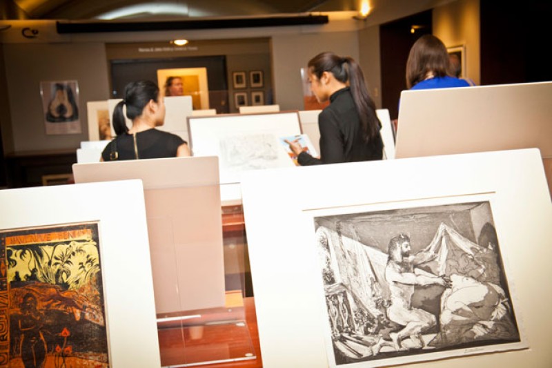 people looking at prints