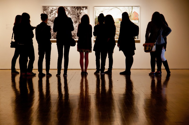 people looking at art