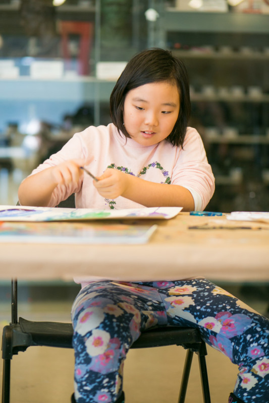Girl working on art with marker