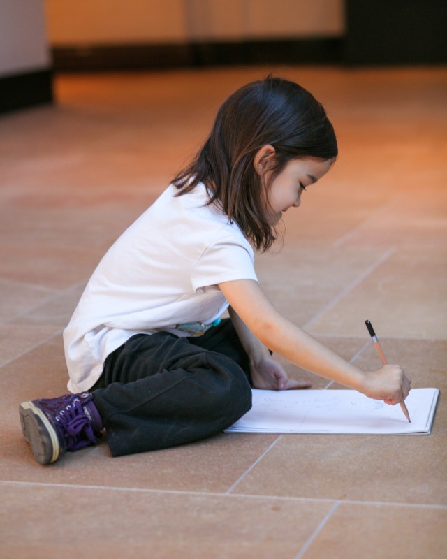 Child drawing in the galleries