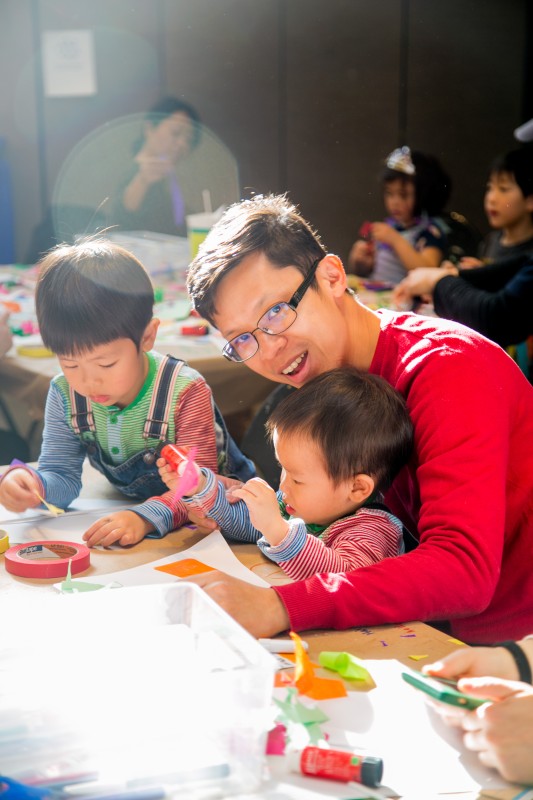 Father and children working on art activities