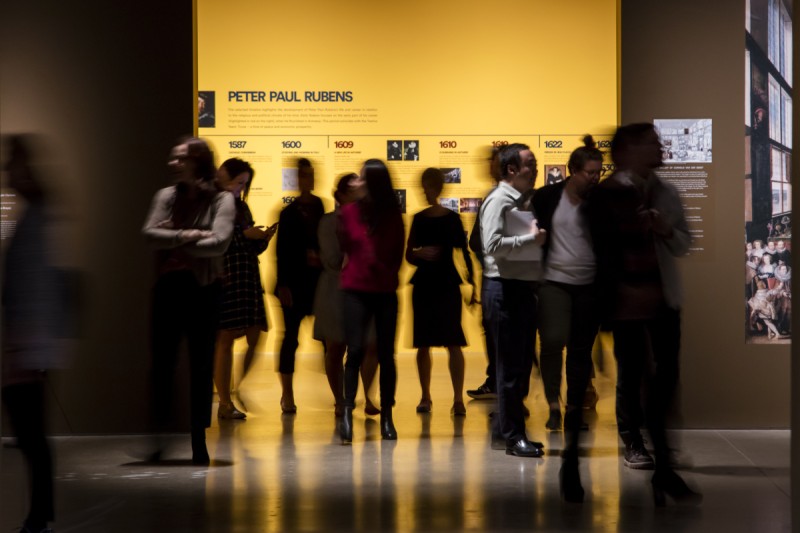 visitors walking into an exhibition space