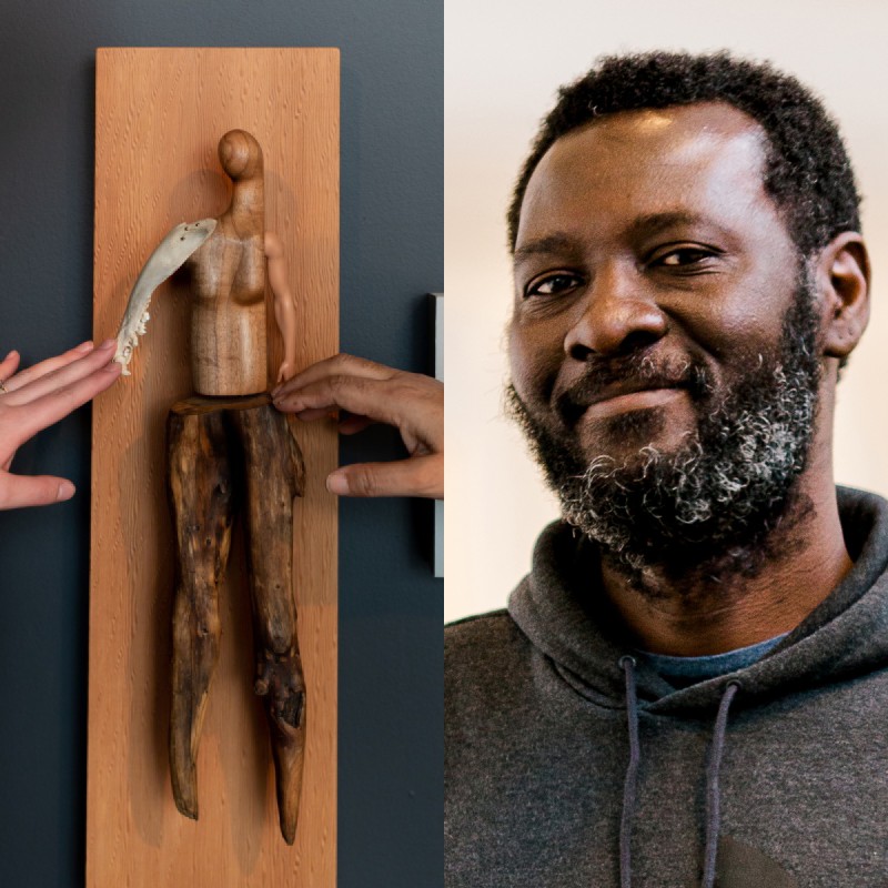 Image split into two: On the left a photo of two hands outside the frame reaching to touch a sculpture by Persimmon Blackbridge. The piece is titled “Soft Touch”, and is a handcrafted figure made of wood, bone and plastic to resemble a person constructed from found objects. It is mounted on a wood panel. On the left photograph head shot of figure looking and smiling at camera 