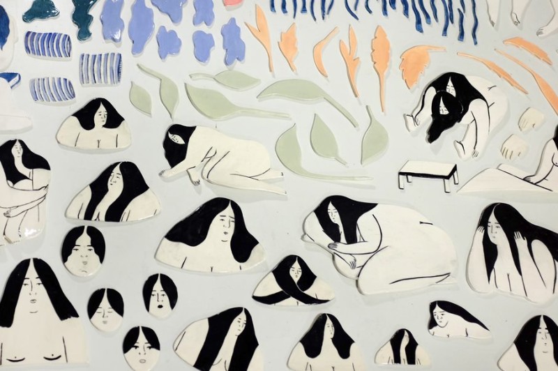 Depictions of women, coloured shapes like leaves, and other shapes.