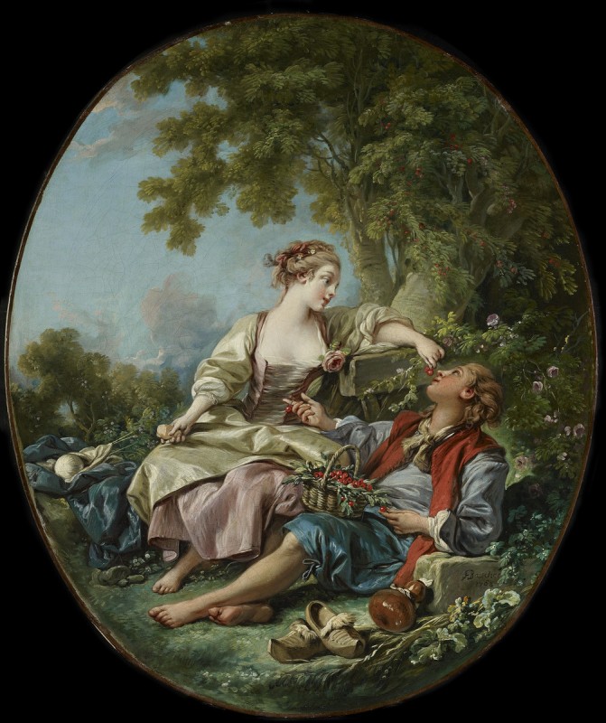 women feeding man cherries