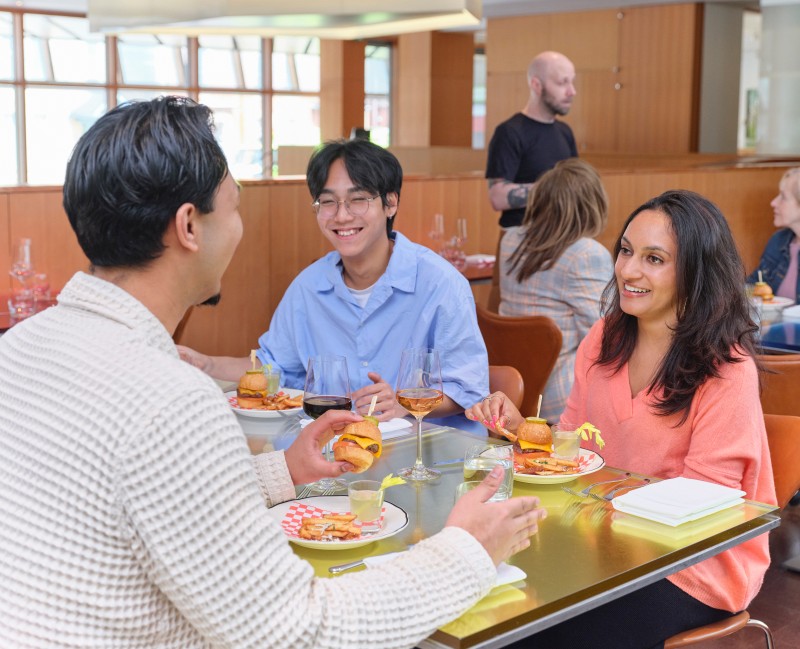 3 people sitting together dining in the bistro