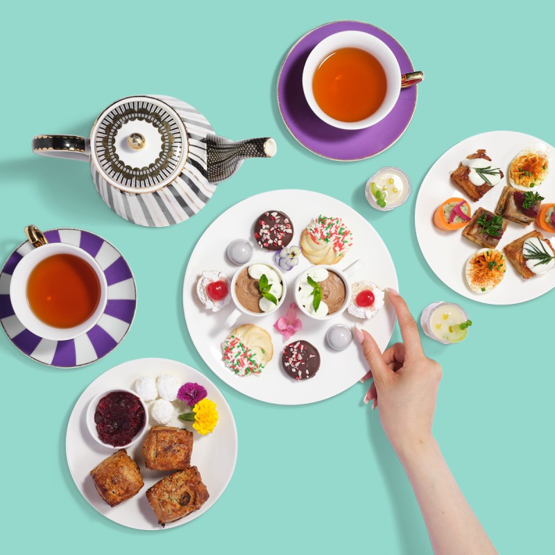 Plates of small bites and tea 