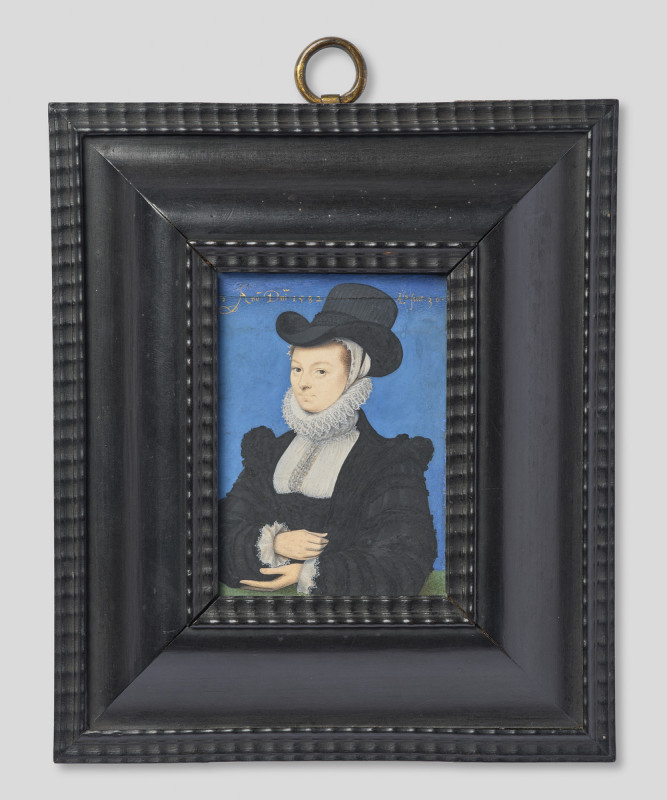 Painting in an ornate black frame of a woman in 1500s menswear.