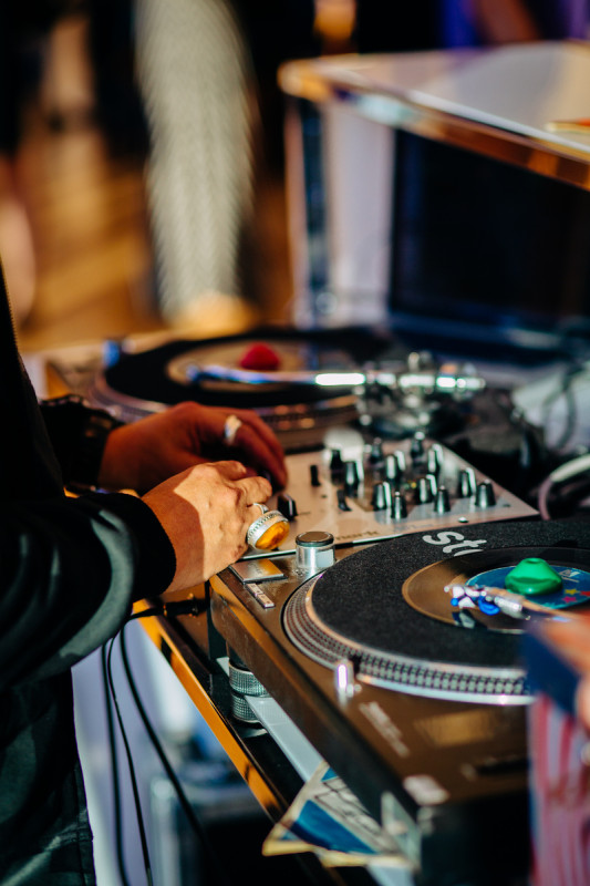 DJ - close up of hand and mixing board