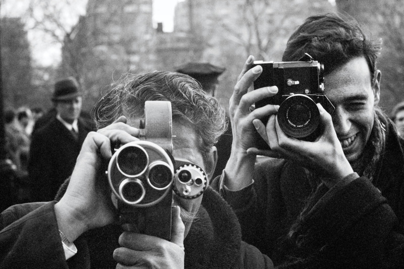 Two men with vintage cameras