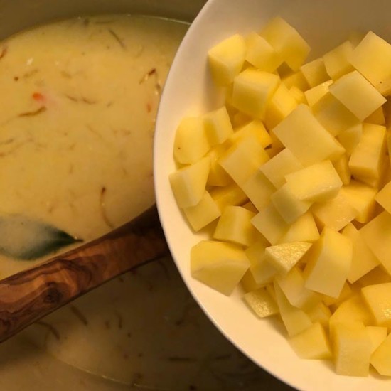 diced potatoes being added