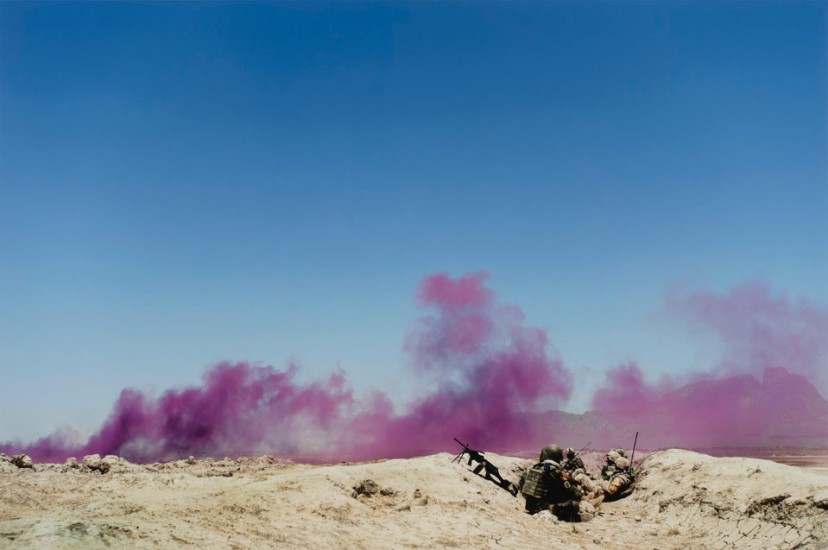 Louie Palu, Afghan and Canadian soldiers in a trench mark their position with purple smoke during a drone strike on insurgents nearby, Panjwa’i District, Kandahar Province