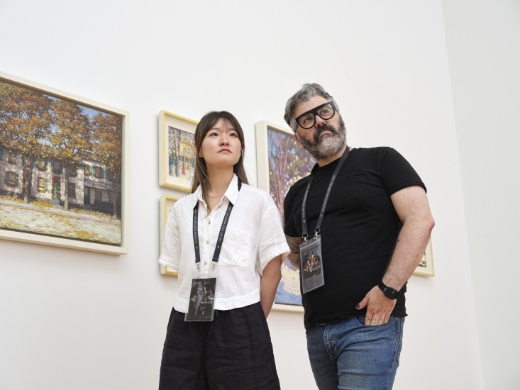 visitors in the gallery wearing Art Rate Monitors