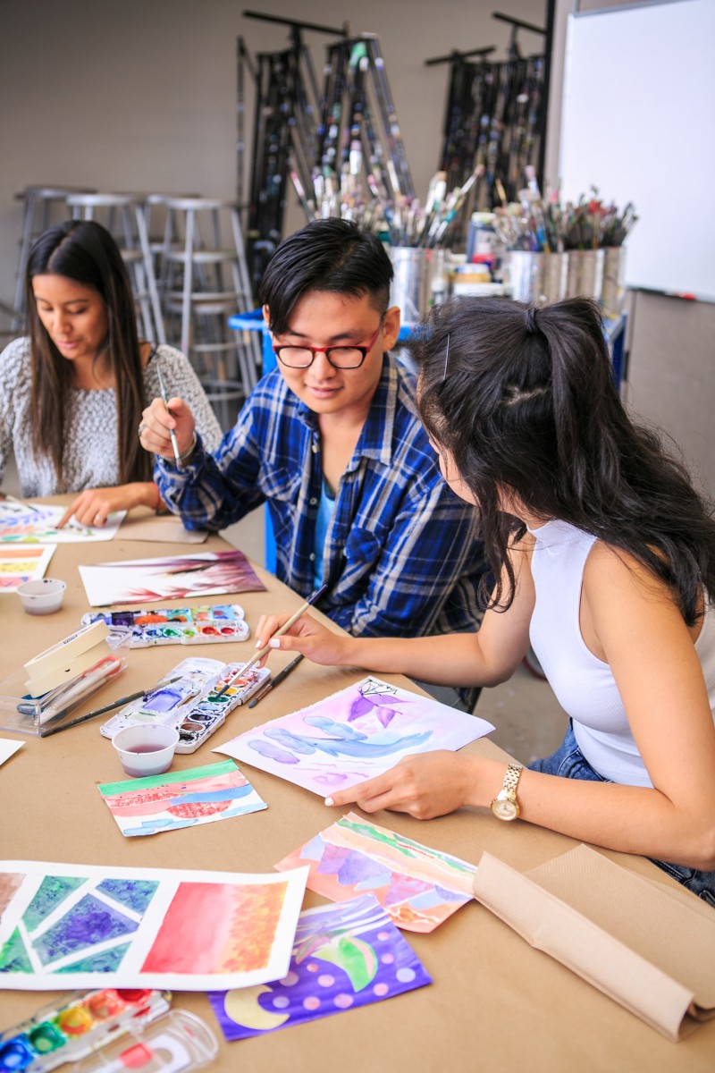 Teenagers painting